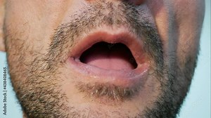 Time lapse of man talking with detail and close up of mouth speaking, movement of mouth, lips and tongue during speech, talkative man