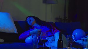 Drunk Woman Lying On Sofa Drinking Alcohol At House Party 1 | Free Stock Video Footage