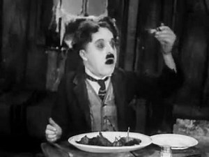 charlie chaplin eating a shoe شارلى شابلن بياكل جزمة