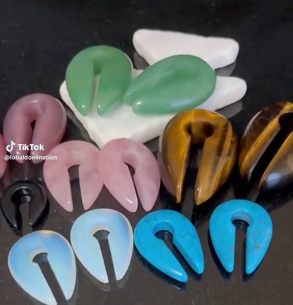 Opalite Keyhole Hanger Ear Weight Plug *PLEASE NOTE* - the size ordered will be the size at the point where it hangs on your lobe, however the size at the largest point of the prong (that you must slide your lobe over to get the worn area) is about one size larger. You may consider ordering a size smaller than your actual size if that sounds to you like it might be a problem (for some it isn't, but for many it is) Material - Opalite Stone This is organic jewelry and is subject to variations in s