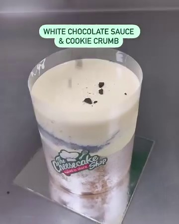 5.6K views · 42 reactions | Load up our Cookies and Cream Fountain Cake with us!  Our signature white choc mudcake topped with creamy cheesecake, smooth white chocolate sauce and crunchy cookie pieces! An explosion of epic flavour – you've gotta try it! Order now. Link: https://www.cheesecake.com.au/our-cakes/fountain-cakes/cookies-cream-fountain-cake #cheesecakeshop #bakedinstore | The Cheesecake Shop | Facebook