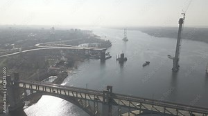 Zaporozhye, Ukraine, construction of a bridge in Zaporozhye, construction of a bridge across the Dnieper River, drone flight over the construction of a bridge in Zaporozhye in summer