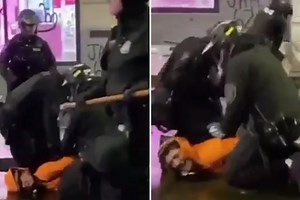Seattle cop removes fellow officer’s knee from suspect's neck as protesters scream