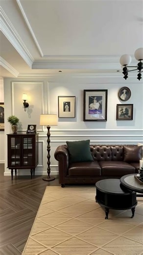 Brown leather sofa + beige armchair + black coffee table — Warm and inviting