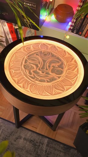Grounded Labs on Instagram: "Radiant energy captured in sand ☀️✨ Watch the Oasis Side Table trace a perfect, mesmerizing sun - bringing warmth, light, and motion to your living space. Where art meets astronomy, each gentle movement reveals the cosmic dance of our celestial centerpiece. Illuminate your home with living art. #kineticart #kineticsand #sunart #oasistable #artfurniture #homedecor #interiordesign #cosmic #sandart #livingart #minimalism #moderndesign"