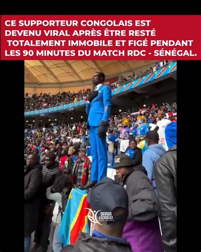 Bana_kongo2 on Instagram: "Ce supporter emblématique des Léopards, nommé Michel Kuka Mboladinga et âgé de 53 ans, est devenu une véritable sensation sur les réseaux sociaux. Connu sous le surnom de « Lumumba Vea », il reste figé pendant 90 minutes face au terrain, la main levée, afin de reproduire la mythique statue de Patrice Lumumba située à Kinshasa. Grâce à sa coiffure, ses lunettes et son costume, il incarne le héros national à la perfection au sein du groupe d’animation officiel. ​#MichelK