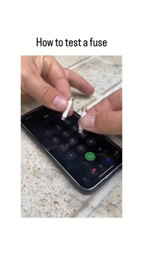 scroll_world2026📜 on Instagram: "This instagram reel features a 20-second video humorously depicting fuses placed on a smartphone's dial pad as a mock "testing" method, where hands press them like buttons to "dial" a number, playing on the absurdity for comedic effect. Posted on 30 December 2025 by diira_ , it garnered over 1.7 million views and 2,200 likes within hours, sparking playful Indonesian-language replies debunking the technique while embracing the chaos. In reality, fuses are tested 