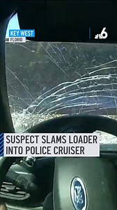 Body camera video captures the moment a Key West Police cruiser was hit head-on by heavy machinery driven by a suspect who was later arrested.⁠ ⁠ On May 4, the officer was responding to reports of a man using a loader to destroy vehicles and a building at the College of the Florida Keys.⁠ ⁠ But bodycam video shows the moments the loader struck the cruiser. The officer then runs out of the vehicle and starts shooting, but none of the shots hit the suspect.⁠ #keywest #police #caughtoncamera | NBC 