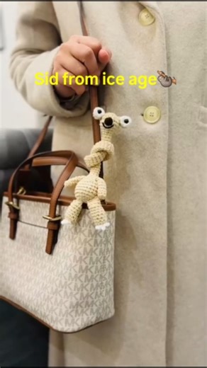 Lia | Crochet Artist on Instagram: "Sid from ice age sloth! Dm to get yours! Follow for more! [Crochet, handmade, keychains, ice age, sid, sloth, viral, trending]"