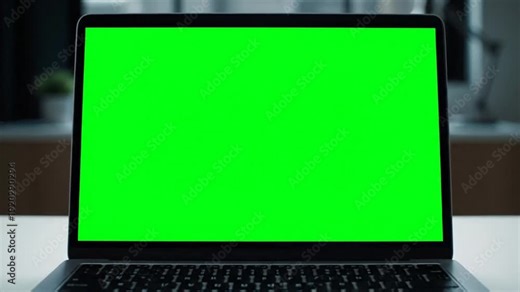 A laptop with green screen animation mockup on a desk for video
