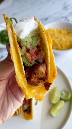 1.9K views · 21 reactions | These cheesy taco shells are super simple to make and a fun way to spice up taco night! You just need 3 simple ingredients! Ingredients ▢1 hard taco shell ▢1 soft flour tortilla of roughly equal size to the hard shell ▢2-3 tablespoons of shredded cheese ▢Cooking spray | Food With Feeling | Facebook