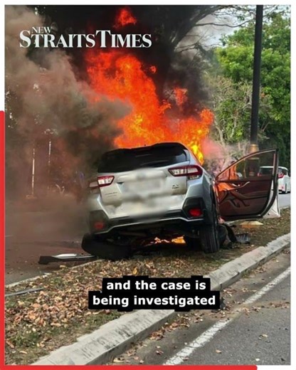 Woman escapes from car moments before it bursts into flames