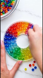 5.7K views · 37 reactions | Melted Bead Suncatchers Materials: Faceted acrylic beads Food coloring (optional) Eco-friendly glitter (optional) Mini charms or small crystals (optional) Fishing line Create vibrant and eye-catching suncatchers that will add a splash of color to any window. With the addition of glitter and charms, each piece becomes a unique work of art that sparkles in the sunlight. | Homemade Recipes | Facebook