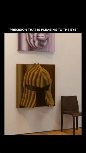 SocialDorm on Instagram: "The video is a 16-second CGI animation showing an anamorphic wall relief made of horizontal striped panels in green, purple, and gold. As the camera moves, the layered panels smoothly shift to form two different faces—one resembling Shrek, the green ogre, and the other resembling Thanos, the purple titan. The effect creates an optical illusion that is only visible from specific viewing angles. Credit & Source: The original source is unclear, but the video is widely cred