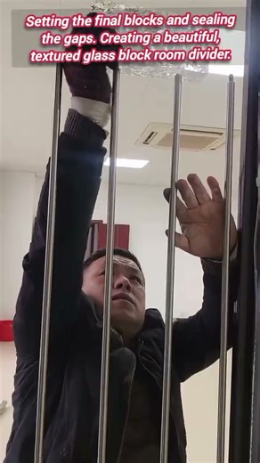 ​Glass block wall installation creates beautiful light-diffusing room divider.