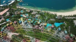 Top view colorful ferris wheel spinning. Sunset in background. Ride on carousel represents entertainment. Colorful Ferris wheel spinning slowly in big amusement park with sky sunrise in background. 4K