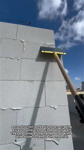 Construction Work: Scraping Excess Mortar
