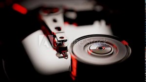 Hard disk drive. Hi tech work in motion. Spin up disk inside computer. Close-up view of working, opened hard disk drive 60 fps