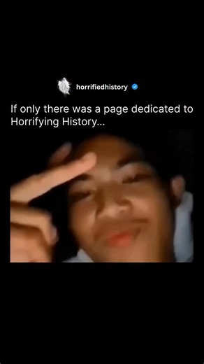 Horrifying History on Instagram: "On the night the video was recorded in 2021, a father and his son went to bed around 9:00 PM. The father fell asleep quickly, but the son remained awake using his phone in the dark. While watching videos, he accidentally activated the front-facing camera, which began recording without his knowledge. As he looked at the screen showing his own face, he noticed a strange, shadowy figure in the background of the shot. The figure was not lying down but was standing m