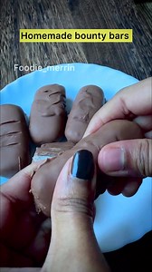 3 ingredients only!! . . . 📍In a bowl, take the desiccated coconut and sweetened condensed milk. Using a spatula, mix both ingredients till you get a sticky mixture. 📍Form the mixture into rectangle bars. Freeze for 15 minutes/until solid. 📍Melt milk chocolate in a double boiler over low-medium heat. 📍 Dip the coconut bars in the melted chocolate, turn over with a fork to coat them. Using the fork, lift it and allow the excess chocolate to drip back into the bowl. Place it on the butter pape