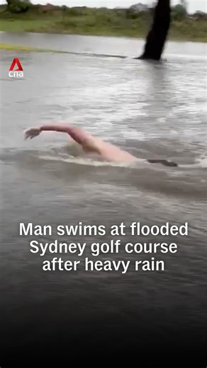 A man was filmed swimming across a flooded golf course on Sydney’s northern beaches after heavy rain turned Palm Beach Golf Course into a makeshift lake. The clip was among a wave of videos shared online as torrential rain lashed the city over the weekend. #australia #australianews | CNA