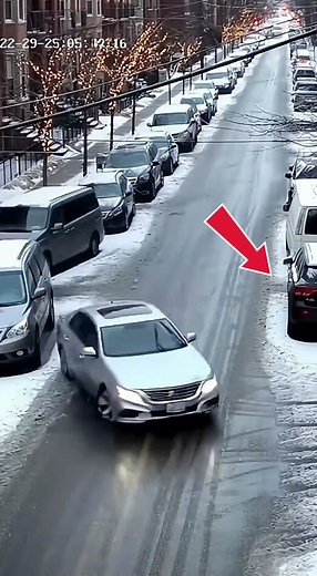 Car Slides Out of Control on Icy Street CCTV