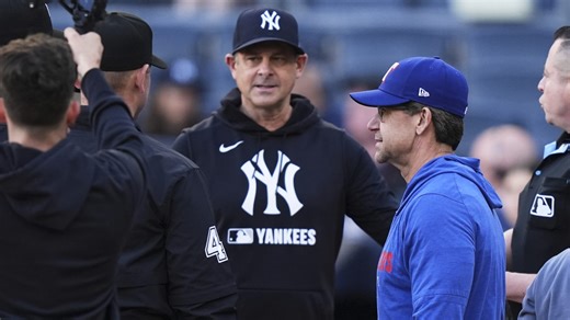 Bret and Aaron Boone exchange lineup cards pregame