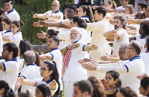Prime Minister Narendra Modi, who has cracked down on dissent in India, looked to stress unity as he started a three-day visit to the U.S., participating in a group yoga session for international diplomats on the lawn of the UN headquarters. https://nyti.ms/3XjolTK | The New York Times