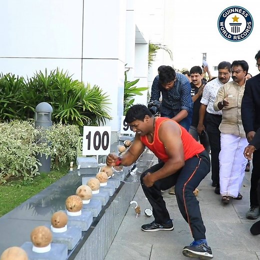Breaking a coconut with a hammer can be challenging - Abheesh P. Dominic from Kerala in India smashed 122 coconuts in one minute with his hand! 💪🥥💦 | Guinness World Records