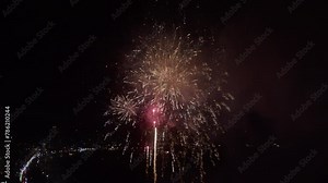 Bright New Year's fireworks 2023. beautiful new year's eve. glowing loop christmas bokeh. holiday day christmas. beautiful bright color spot show. eve New Year's holiday. national festival sky. 4K