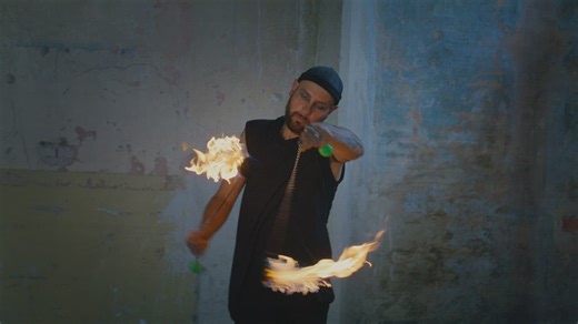 Juggler doing tricks with balls of fire - Free Stock Video