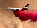 Plane drops fire-retardant chemical on massive wildfire in Arizona