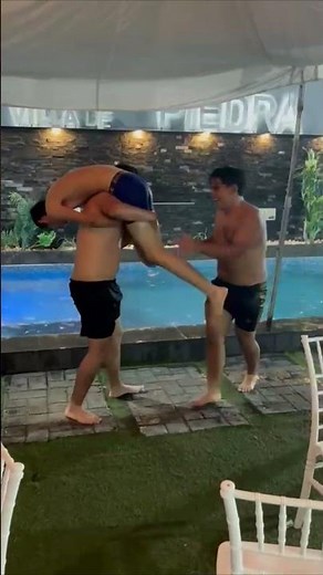 Friends Toss Each Other into a Swimming Pool During a Summer Party