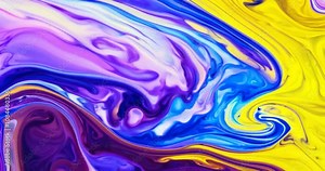 Close-up shot of dynamic fluid animation in swirling, bright hues of purple, blue, and yellow, with an organic flow that resembles colorful ink blending in water. Stock Video