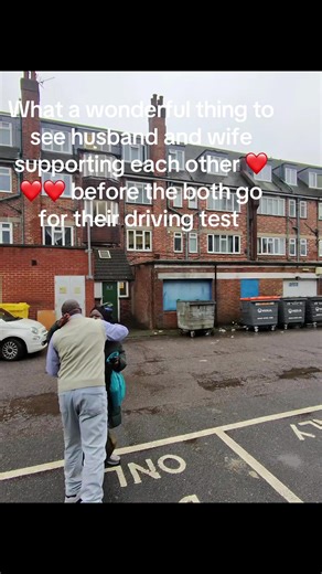 Husband and Wife Support Each Other Before Driving Test