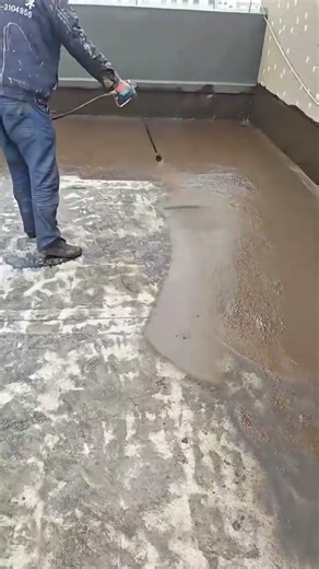 Applying liquid waterproofing membrane to the flat rooftop surface for protection