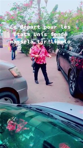 Man Interacting with Black SUV in Vibrant Outdoor Scene