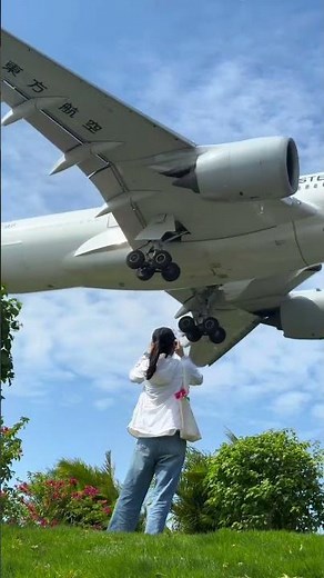 China Eastern Airlines' Airbus A350's most stylish sunglasses-wearing man's head-shaved landing