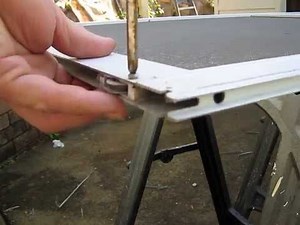 Installing new fly wire screen door wheels