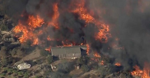 Wildfires devastate mountains east of Los Angeles