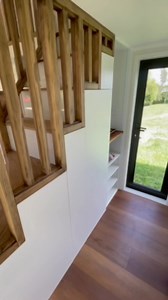 Immerse yourself in this game changer of a tiny home!! With no more raised bed platforms or walking channels around the bed - that’s right!! Enjoy the full flat floors and connecting walkway with full standing height!! Our ‘CASITA’ at 10.6m L x 3m W is an outstanding tiny home with its Karaka green exterior steel cladding it blends seamlessly into the landscape. As you enter through the large trifold doors you are welcomed into the open plan lounge with large picture window and kitchen with the 