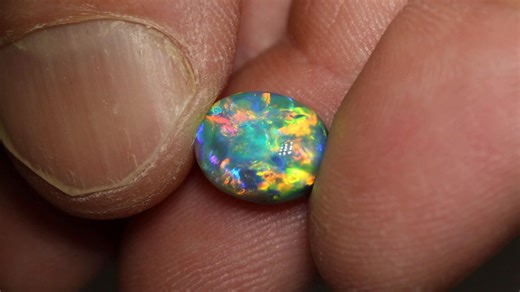 Phenomenal doesn't cut it; this incredible Black Opal is out of this world! 😍⁠ The colors, the play-of-color, the patterns and the vibrancy ⚡️✨️⁠ That fresh aqua blue and green mixed with juicy orange and regal gold— you can't quite beat it!⁠ 3.92ct gem black opal 10.8×8.7×6.1mm https://blackopaldirect.com/products/3-92-ct-gem-black-opal-10-8x8-7x6-1mm | Black Opal Direct