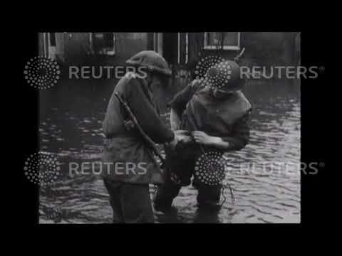 1944 Allied troops check lines covered by water in the Netherlands