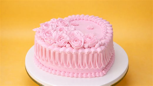 Pink cake with floral cream decoration