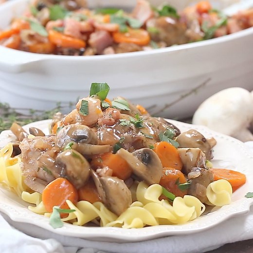 This Instant Pot / Pressure Cooker Coq au Vin is a classic French chicken stew made with chicken thighs, onions, carrots, mushrooms, and topped with bacon. You can make this slow-cooked favorite in a fraction of the time in a pressure cooker or Instant Pot. https://www.pressurecookingtoday.com/pressure-cooker-coq-au-vin/ | Pressure Cooking Today