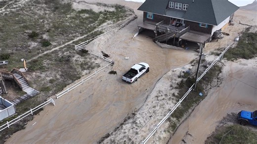 Highway 12 remains closed with sand and erosion across many roads. Homes here survived, but vehicles are buried. #NCwx #NorthCarolina #weather | Meteorologist Brett Adair