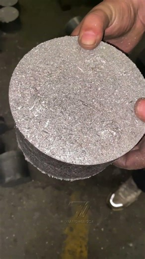 Let's see what these metal shavings are, and how they got pressed into a cake?