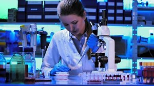 Female Scientist Looking Through Microscope Laboratory Stock Footage Video (100% Royalty-free) 1085894078 | Shutterstock