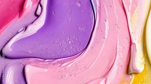 Colorful abstract paint swirl created on a smooth surface in a creative art studio setting during daylight hours