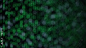 Blurry Close-Up of Green and White Matrix-Like Code on a Black Screen, Representing a Digital Data Stream.